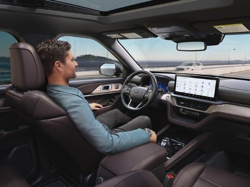 2025 Ford Explorer view of man in front seat without hands on wheel while vehicle is in BlueCruise mode